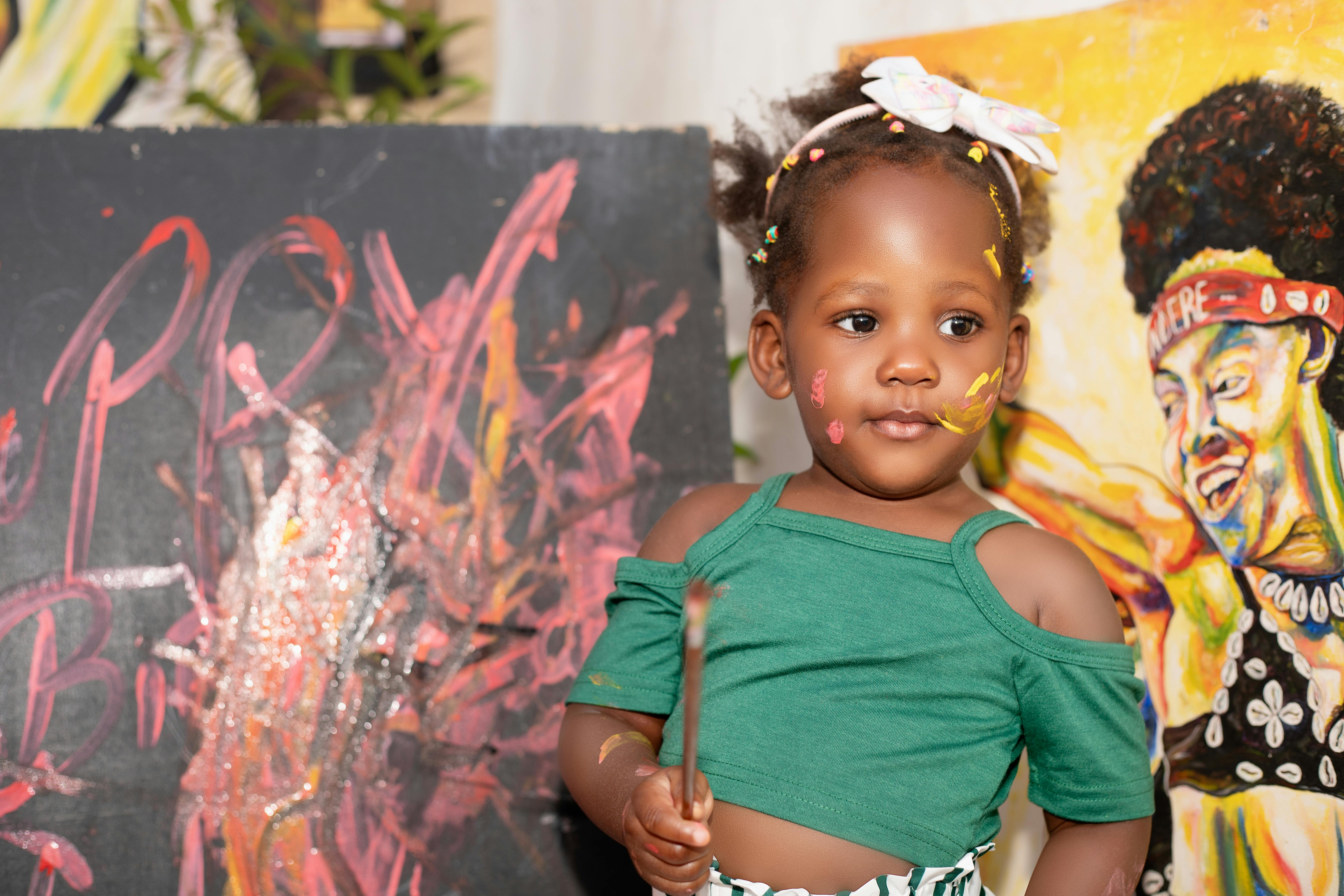 Children painting during outreach